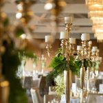 For the centerpieces, we wanted that touch of vintage, choosing golden candelabras with cascading florals down the stems.